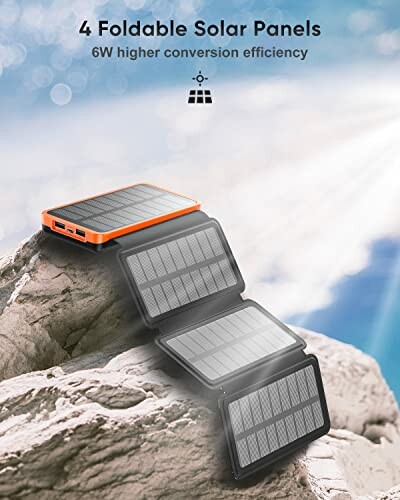 Four foldable solar panels on a rock with sunlight.