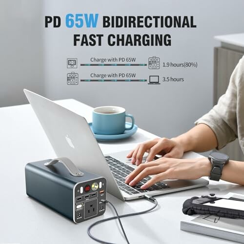 Person using a laptop with a portable charger on a desk, illustrating PD 65W bidirectional fast charging capabilities.