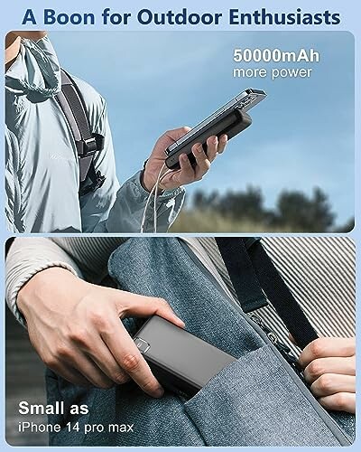 Person holding a compact power bank, labeled 50000mAh, ideal for outdoor use.