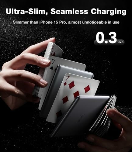 Hands holding ultra-slim charging device with playing cards.
